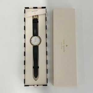 Kate Spade black leather watch; monogram letter R with gold rim.